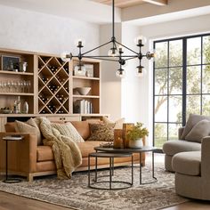 a living room filled with furniture and a wine rack