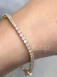 DETAILS: * Handmade item * Gemstone: Lab-grown Diamonds * Band Color: Gold (may vary on gold selection) * Condition: Never been Used; Made to order, Recycled Metal, Conflict-free 100% DESCRIPTION:  💎 Welcome to the Our Shop, Congratulations 🍾 on discovering us. 💎  Beautiful and Elegant, this women's Gold Tennis bracelet is a must-have. This custom-made to-order lab-grown diamond tennis bracelet is the perfect gift for all you beauties who love sparkle and shine. A row of scintillating lab-created round brilliant diamonds are lined up perfectly to create the most stunning diamond bracelet. Made with a double secure lock at the back. Thanks to our trained gemologist who inspects every one of them! A popular cut, this style has become one of today's favorites because it not only shines bri Gold Dainty Tennis Bracelet With Prong Setting, Dazzling Round Gold Bracelet For Anniversary, Dazzling Gold Bracelet As Gift, Rose Gold Diamond Bracelet With Prong Setting, Gold Dainty Diamond Bracelet With Round Cut, Gold Round Cut Dainty Diamond Bracelet, Gold Dainty Round Cut Diamond Bracelet, Dainty Gold Diamond Bracelet With Vvs Clarity, Gold Dainty Diamond Bracelet