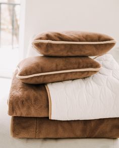 three pillows stacked on top of each other