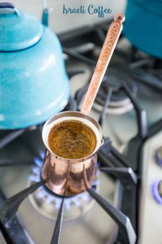 there is a small copper cup on the stove