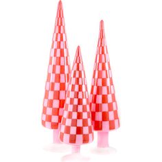 three red and white checkered cones are on top of each other in the shape of trees