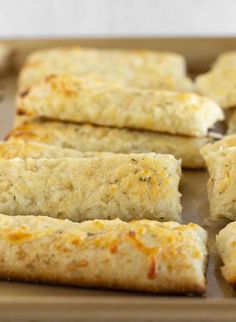 some food that is sitting on a baking sheet and ready to be cooked in the oven