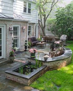 an outdoor patio with seating and landscaping