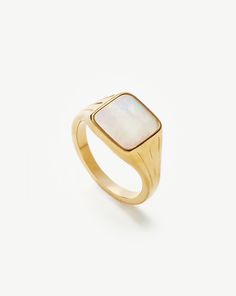 Lucy Williams Square Signet Ring | 18ct Gold Plated Vermeil/Mother of Pearl. A Vintage-Inspired Take on the Classic Signet Ring, this Mother of Pearl Gemstone is Believed to Attract Abundance and Prosperity. Style this Signature Piece Solo, Wear It on Your Pinky, or Stack with More Delicate Styles. Metal: 18Ct Recycled Gold Plated Vermeil on Recycled Sterling Silver Gemstone: Mother of Pearl Band Width: 1. 8mm Stone Dimensions: 11mm Weight: 5. 3g Product Code: Lws-G-R6-Mop Luxury 14k Gold Opal Ring, Luxury Gold Opal Ring, Luxury Polished Moonstone Ring, Luxury Yellow Gold Opal Ring With Polished Finish, Luxury White Signet Ring With Polished Finish, Luxury Polished Moonstone Ring In 14k Gold, Luxury 14k Gold Moonstone Ring With Polished Finish, Classic Yellow Gold Moonstone Ring With Polished Finish, Luxury 14k Gold Moonstone Ring For Formal Occasion