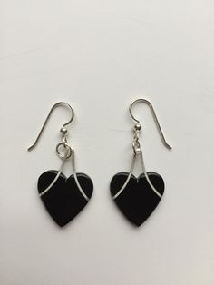 "Heart Earrings and Necklace Set. Silver and Ebony or PauBrasil. The Pau Brasil has a beautiful deep red color. The Ebony is jet black. A groove is precisely cut and the silver wire is pressed and glued in. The wire is Argentium silver. A sterling silver that tarnishes much slower than traditional sterling silver. The 16\" chain is also Argentium Silver. The ear wires are sterling silver. A timeless look. Contemporary not trendy. This set will be in style for years to come. The pieces go well to Handmade Black Heart Earrings, Black Heart Charm Earrings As Gift, Black Earrings With Heart Charm For Gift, Black Heart-shaped Earrings For Gift, Elegant Black Heart Earrings For Anniversary, Black Heart-shaped Pierced-style Jewelry, Black Heart-shaped Earrings With Hooks, Black Heart Earrings With Ear Wire, Heart-shaped Black Earrings