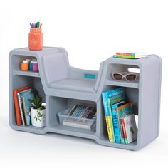 a gray book shelf with books and glasses on it