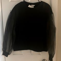 Black Mesh Sleeve Crew Neck Sweatshirt ( New With Tags) Brand: Hm Winter Crew Neck Top With Sheer Sleeves, Winter Sheer Sleeves Crew Neck Top, Black Tops With Ribbed Cuffs For Spring, Trendy Black Top With Sheer Sleeves, Casual Sheer Sleeves Top For Layering, H&m Casual Tops With Ribbed Cuffs, Casual H&m Tops With Ribbed Cuffs, H&m Black Relaxed Fit Top, H&m Long Sleeve Tops With Ribbed Cuffs