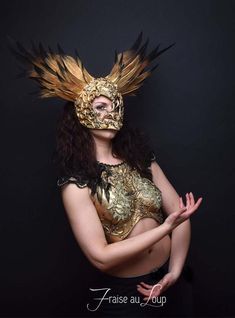 Coiffe ... Reine des EnfersHeaddress "Fraise au Loup Studio"Mask Valkyrie feather headgear. Gold / Black Gradient PaintDecoration gold patina. Baroque moldings made by the AtelierUnique creation of the workshop. Crafted, carved and hand paintedUnique CreationAdjustable elastic link for holdingIdeal accessory for a stage - Cabaret - Burlesque - Drag queen ... or photo shootsFacebook page - https://www.facebook.com/fraiseauloupcostumes Cabaret Burlesque, Cabaret Costume, Burlesque Costume, Costume Masks, Costume Mask, Armor Concept, Fantasy Clothing, Headdress, Fancy Dress