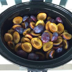 the plums are in the slow cooker ready to be cooked and put into the oven