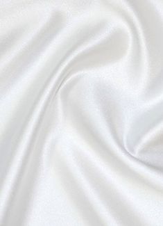 "We coined the name \"Mystique Satin\" in the 80s and its popularity has skyrocketed. Also known as Lamour Satin or Matte Satin. This fabric is 100% polyester, 62\" wide, 4.5oz, and it's extremely versatile. One side is medium shine and the other is matte. Color Shown - Ultra White To choose our other 130+ colors see our main listing here - https://www.etsy.com/listing/830110017/mystique-satin-lamour-satin-medium-shine Uses: 1. Fashion - evening wear, dresses, lining, ties, etc. You can find thi Gowns Bridesmaid, Duchess Satin, Rainbow Aesthetic, Bridal Fabric, Trendy Wallpaper, 背景 シンプル, Aesthetic Colors, Matte Satin, White Wallpaper