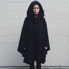 I’m Selling This Handmade Black Hooded Poncho Cloak That I Had Custom-Made. It’s Made From Super Thick, Cozy Fleeceperfect For Those Chilly Nights, Whether You’re Out For A Walk Or Casting Spells Under The Moonlight. The Hood Is Lined With Fleece And Has A Drawstring, So You Can Bundle Up, And There Are Fleece-Lined Pockets To Keep Your Hands Warm Too. Material: Heavy Black Fleece, Super Warm & Comfy Size: One Size Fits Most (I’m 5’7” And It Fits Me Great!) Care: Machine Wash Cold With Dark Colo Black Hooded Cape, Poncho Cloak, Casting Spells, Black Poncho, Under The Moonlight, Goth Look, Hooded Cape, Hooded Poncho, Witchy Vibes