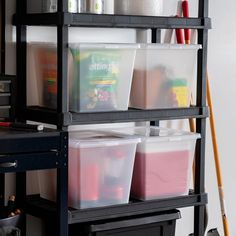 the shelves are filled with plastic containers and supplies