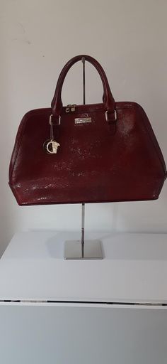 Versace Collection stunning large red satchel bag.  Gorgeous bag. It measures approximately  18" L. 12" H. 7" D. 6" Drop Like New.  It looks like it was never used.  The only flaw I see is tiny scuff on front bottom edge as seen in last photo. Red Satchel With Handle Drop For Office, Designer Burgundy Satchel Bag, Designer Burgundy Satchel For Shopping, Designer Burgundy Satchel With Detachable Handle, Classic Red Handheld Satchel, Classic Handheld Red Satchel, Formal Handheld Burgundy Satchel, Designer Burgundy Satchel With Top Handle, Designer Burgundy Top Handle Satchel