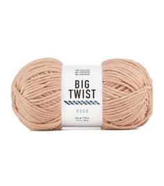 a ball of yarn with the words, big twist in white and pink on it