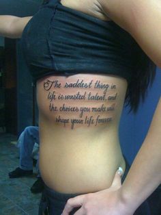 the back of a woman's stomach with an inscription on it that reads, the saddest thing in life is twisted talent and the choices you make will shape your life