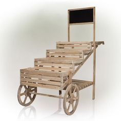 a wooden cart with wheels and a chalkboard on the top that is attached to it