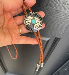 This awesome bolo tie has a southwestern design and turquoise centerpiece. Our bolos pair nicely with many of our belt buckles! They make wonderful gifts. The western bolo tie rope length is 100cm(39") Turquoise Centerpieces, Western Bolo Tie, Southwestern Design, Bolo Tie, Belt Buckles, Turquoise Bracelet, Turquoise Necklace, Turquoise, Sun