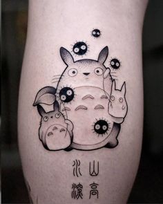 an image of a tattoo on the leg of someone's leg with some animals in it