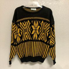 Black and yellow, black and yellow!  You know what it is!  An awesome sweater (awesome sweater). Details: 100% Acrylic Made in 1970s (70s) Made in USA Size: Women's Medium (M) Brand: Glamour-Knit Condition: Very good  Machine or hand wash warm Main colors: Black, yellow Measurements: Chest 44.5 in Length  23.5 in Shoulder 25 in Disclaimer:  It is the buyer's responsibility to wash the article of clothing before wearing it.  Any mishaps that may occur due to wearing the clothing before washing it are the responsibility of the buyer and not TheGreatAdvintage.  (The shirts have been washed and cleaned beforehand, but still wash it before you wear it!) My collection consists of pieces that are of vintage condition, which means that all my items are second-hand and used. Customers are not purch Vintage Black Sweater For Fall, Winter Yellow Jacquard Knit Sweater, Yellow Jacquard Knit Sweater For Winter, Vintage Black Fitted Sweater, Retro Yellow Long Sleeve Sweater, Yellow Knitted Crew Neck Sweater, Yellow Crew Neck Sweater For Winter, Yellow Knitted Retro Sweater, Mustard Retro Long Sleeve Sweater