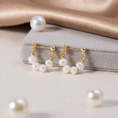 Celine Pearl Hoop Earrings – Beautiful Earth Boutique Classic Pearl Huggie Jewelry, Pearl Charm Huggie Jewelry For Anniversary, Huggie Pearl Charm Jewelry For Anniversary, Elegant Gold Huggie Earrings With Pearl Charm, Elegant Gold Pearl Huggie Earrings, Anniversary Huggie Jewelry With Pearl Charm, Classic Tarnish-resistant Pearl Jewelry, Pearl Huggie Earrings For Anniversary, Pearl Huggie Jewelry For Anniversary