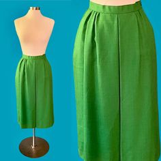 Vintage 80's Worthington bright green midi skirt *ITEM DETAILS* - Era- 1980's - Brand- Worthington  - Material- SHELL-50% Rayon 50% Polyester LINING- 100% Nylon  - Color- Bright Kelly green - Size- 10 (please see the measurements for an accurate fit)  - Fully lined - Side zipper and button closure *This item is in excellent (pretty much perfect!) vintage condition with no holes or stains.* *shown here on a size 6-8 mannequin, it was pinned about an inch at the waist* *measurements taken while fl Green Midi Length Workwear Bottoms, Green Midi Length Lined Skirt, Green Lined Midi Skirt, Vintage Green Full Skirt Bottoms, Vintage Green Full Skirt, Vintage Green Skirt For Spring, Vintage Green Skirt For Summer, Vintage Green Summer Skirt, Retro Green Midi Skirt