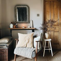 a living room filled with furniture and a mirror