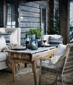 a living room filled with furniture next to a wooden table