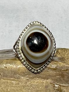 Agate Shiva Eye Ring 925 Sterling Silver Ring Natural Agate Shiva Eye Ring Birthstone Gift Agate Shiva Eye Ring Handmade item Ring Size : U S A : All Available Materials: 92.5 Sterling Silver Gemstone: Natural Agate Shiva Eye Stone Size: 15x21 MM Weight : 8.93  gm Style: Art Deco Made to Order Traditional Silver Agate Ring, Symbolic Eye-shaped Silver Jewelry, Spiritual Silver Cabochon Rings, Spiritual Sterling Silver Eye-shaped Jewelry, Spiritual Hand-strung Agate Jewelry, Shiva Eye, Ring Birthstone, Eye Stone, Eye Ring