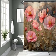 a shower curtain with pink flowers on it in a gray and white bathroom, next to a toilet