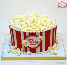 a birthday cake made to look like a popcorn bucket