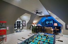 a room that has a foosball table in it