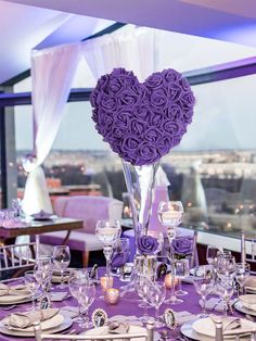 the centerpieces on this table are made out of purple roses