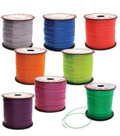 spools of neon colored wire on white background