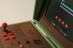 a close up of an arcade machine with buttons