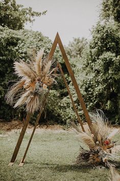 an instagram page with two fake plants in the grass and one is upside down