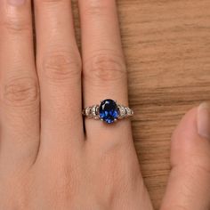 It is a lab sapphire ring. The main stone is 7 mm*9 mm oval cut.weight about 2.32 carats. The basic metal is sterling silver and plated with rhodium. To change the metal to a solid gold (white/rose) or platinum is also available, please ask for a quotation if you want. You can also go to my shop Home for more elegant rings: https://www.etsy.com/shop/godjewelry?ref=hdr_shop_menu Sapphire is the September birthstone. More sapphire rings: https://www.etsy.com/shop/godjewelry?section_id=20715031 Cus Oval Lab-created Sapphire Wedding Jewelry, Oval Lab-created Sapphire Jewelry For Wedding, Wedding Jewelry Oval Lab-created Sapphire, Wedding Oval Lab-created Sapphire Jewelry, Oval Birthstone Jewelry With Lab-created Sapphire, Oval Lab-created Sapphire Birthstone Jewelry, Oval Sapphire Solitaire Jewelry, Oval Lab-created Sapphire Birthstone Ring, Oval Lab-created Sapphire Gemstone Jewelry