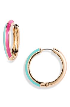 Glossy two-tone hues add a pop of playful color to statement hoop earrings. Metal Imported Blue Hoop Earrings For Spring, Multicolor Small Hoop Earrings For Spring, Trendy Blue Hoop Earrings For Spring, Chic Small Hoop Earrings For Spring, Trendy Small Hoop Earrings For Spring, Pink Hoop Earrings For Spring, Chic Small Hoop Pink Jewelry, Trendy Spring Hoop Earrings, Chic Pink Small Hoop Earrings