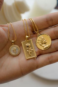 Hand holding 3 gold pendant necklaces. Beautiful Gold Pendants, Necklace Aesthetic, Aesthetic Gold, Diamond Pendants Designs, Medallion Necklace, Gold Necklaces, Match Making, Affordable Jewelry, Pendant Design