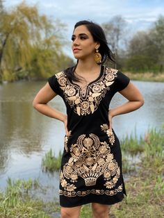 This Beautiful Mexican Gold Floral Dress is the perfect dress for a fun night out or a special event. It's made out of cotton and is full of gold embroidered details. This dress has ties on the back for an adjustable fit. The earrings you can buy too and you can find here https://www.etsy.com/es/listing/637147293/filigrana-redonda-filigrana-clasica?ref=shop_home_active_1&pro=1&frs=1 Mexican Fancy Dress, Mexican Traditional Dress, Mexican Bridesmaid Dresses, Gold Floral Dress, Gold Embroidered Dress, Vestido Charro, Mexican Stuff, Traditional Mexican Dress, Mexican Embroidered Dress