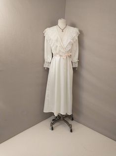 "Beautiful Christian Dior light robe long - mid length, romantic style. Wide lace trim, blush pink ribbon detailing. Inset side pockets Condition is good, with some imperfections. Subtle and scattered pricks to fabric, has been hemmed, replaced belt, some restitching at lace near belt loop. Vintage 90's possibly earlier. Made in USA retains union tag. Quality construction. Washable. Size marked Petite, please go by measurements to determine best fit. Length 51\" Shoulders 15\" Bust to 40\" Waist Feminine Cream Nightgown With Lace Trim, Feminine Delicate Lace Nightgown, Spring Feminine Lace Patchwork Nightgown, Feminine Lace Patchwork Nightgown, Feminine Spring Wedding Nightgown, W Blush, 90s Lingerie, Goth Prom, Green Plaid Shirt