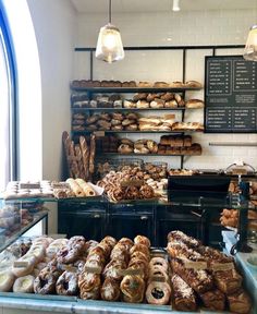 a bakery filled with lots of different types of bread