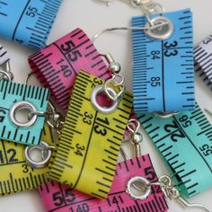 measuring tape earrings with metal hooks on them are colorful and fun for kids to make