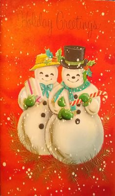 two snowmen are standing next to each other in front of an orange background with the words holiday greetings written on it