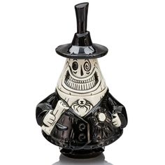 a black and white ceramic figurine with a top hat