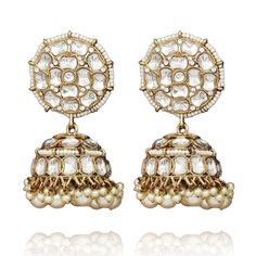 A must-have to create gorgeous everyday looks! Jhumki earrings ornamented with kundan stones and pearls. Approximate earrings length is 2.9" and width is 1.2". Antique gold-plated on high-quality brass as the base metal. In-stock & ready-to-ship. *Please Note: We use faux stones and beads in all of our jewelry. Festival Brass Earrings With Cutdana, Temple Jewelry Style Brass Cutdana Earrings, Temple Jewelry Style Brass Earrings With Cutdana, Brass Cutdana Temple Jewelry Earrings, Bollywood Brass Danglers For Wedding, Brass Chandbali Bridal Earrings, Pearl Drop Kundan Earrings For Reception, Heavy Brass Jhumkas, Festive Brass Chandbali Danglers