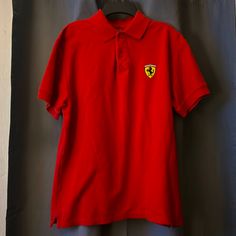 Red Ferrari Polo Tee Never Worn Like Brand New Soft Material No Stains Size Medium Classic Red Fitted T-shirt, Red Fitted Short Sleeve Polo Shirt, Fitted Red Polo Shirt With Polo Collar, Red Fitted Polo Shirt, Fitted Red Polo Shirt, Red Fitted Cotton Polo Shirt, Fitted Red Cotton Polo Shirt, Red Fitted Polo Collar T-shirt, Red Casual Short Sleeve Polo Shirt