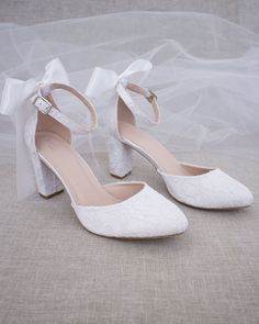 "An all-time classic and elegant style with simplicity of lace heels and wrapped satin tie. DETAILS: HEEL HEIGHT: 3 inches COLORS AVAILABLE: Ivory & White UPPER: Synthetic upper and lining MATERIALS: Mandmade outsole STYLE NAME: JASMIN Not sure of which size to purchase? Shoes measurements are as follow: (Please note measurements taken the length of inside of shoe from toe to heel) Size 5.5- 9.5\" Size 6 - 9.75\" Size 6.5 - 10\" Size 7 - 10.15\" Size 7.5 - 10.25\" Size 8 - 10.35\" Size 8.5 - Women's Slip Ons, Bow Women, Bridal Heels, Lace Heels, Bridesmaid Shoes, Womens Wedding Shoes, Evening Shoes, Bridal Shoes, Wedding Shoes