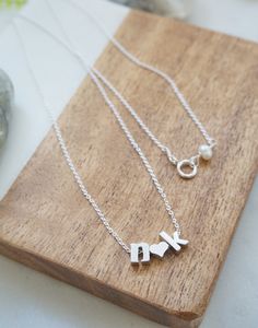 "Personalized letter necklace- Couples Initials Necklace, Tiny letter necklace, Couples necklace, Gift for girlfriend, Valentine's Day Gift, Minimal Necklace, personalized necklace Features: -------------- - rhodium plated charms (hearts and letters) - lowercase block letters - sterling silver chain Personalize this adorable necklace with you and your loved one's initials. Pick the 2 initials from the drop down menu and let me know the length of the chain, up to 19 inches at no additional cost. Initial Pendant Name Necklace For Anniversary Gift, Name Initial Pendant Necklace For Anniversary Gift, Name Initial Pendant Necklaces For Anniversary Gift, Personalized Initial Pendant Necklace For Valentine's Day, Gift Initial Pendant Charm Necklace With Letter Beads, Initial Pendant Charm Necklace With Letter Beads For Gift, Personalized Silver Charm Necklace With Letter Beads, Gift Charm Necklace With Initial Pendant And Letter Beads, Silver Name Necklace For Anniversary Gift