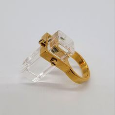 Reisen And Metal - 24k Gold-Plated Measurement: About 1x1x3 Cm Made In Italy (Item#Rb136) Modernist Gold Anniversary Rings, Elegant Gold Crystal Ring With Polished Finish, Modern 14k Gold Crystal Ring For Formal Occasions, Designer Gold Rings For Gift, Modernist Gold Wedding Rings, Designer Gold Wedding Rings, Modern Gold Crystal Ring Gift, Modern Gold Crystal Ring For Gift, Gold Crystal Ring With Polished Finish For Formal Occasions