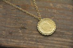 Check out this item in my Etsy shop https://www.etsy.com/il-en/listing/483600689/gold-coin-necklace-coin-necklace-gold Vintage Gold Coin Brass Necklace, Antique Brass Coin Necklace With Round Pendant, Vintage Gold Brass Coin Necklace, Vintage Yellow Gold Brass Coin Necklace, Yellow Gold Medallion Coin Necklace In Brass, Vintage Brass Coin Necklace With Coin Pendant, Vintage Brass Coin Pendant Necklace, Vintage Yellow Gold Round Coin Necklace, Antique Round Coin Necklace